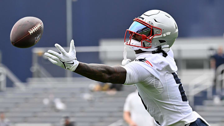 Jun 9, 2025; Foxborough, MA, USA; New England Patriots wide receiver Stefon Diggs (8) has the ball sail past his grip during minicamp at Gillette Stadium. Mandatory Credit: Eric Canha-Imagn Images
