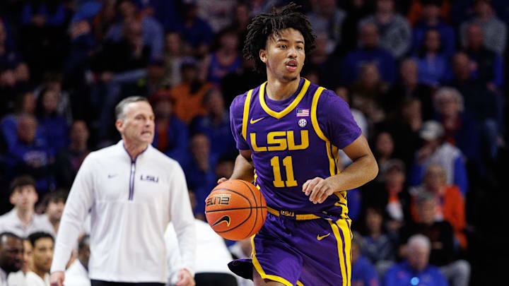 Jan 20, 2026; Gainesville, Florida, USA; Louisiana State Tigers guard Dedan Thomas Jr. (11) dribbles the ball against the Florida Gators during the first half at Exactech Arena at the Stephen C. O'Connell Center. Mandatory Credit: Matt Pendleton-Imagn Images
