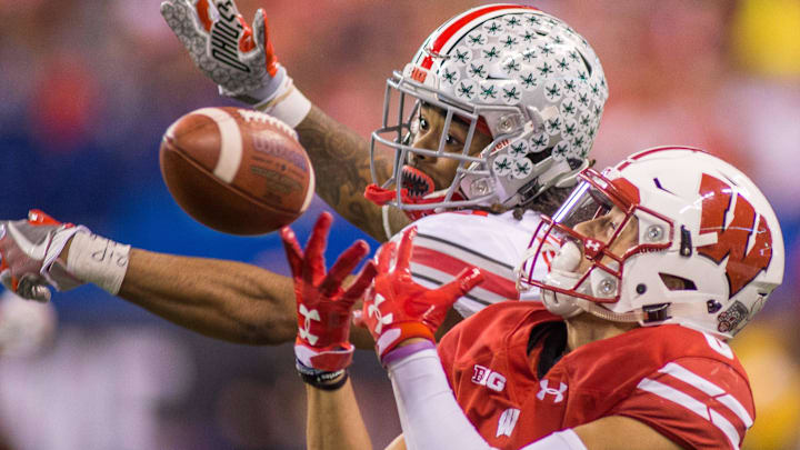 Ohio State Buckeyes cornerback Damon Arnette (3) breaks up a pass to Wisconsin Badgers wide receiver Danny Davis III.