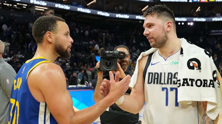 Dec 15, 2024; San Francisco, California, USA; Golden State Warriors guard Stephen Curry (30) and Dallas Mavericks guard Luka Doncic (77) greet each other after the game at Chase Center. Mandatory Credit: Darren Yamashita-Imagn Images