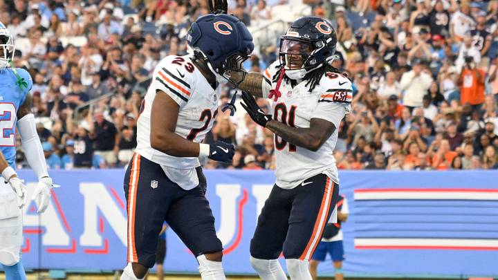 Zavion Thomas celebrates with Roschon Johnson (left) after the rookie's TD catch against Tennessee in preseason.