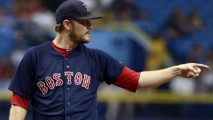 Former Boston Red Sox starting pitcher Wade Miley (20) points during the first inning against the Tampa Bay Rays at Tropicana Field.