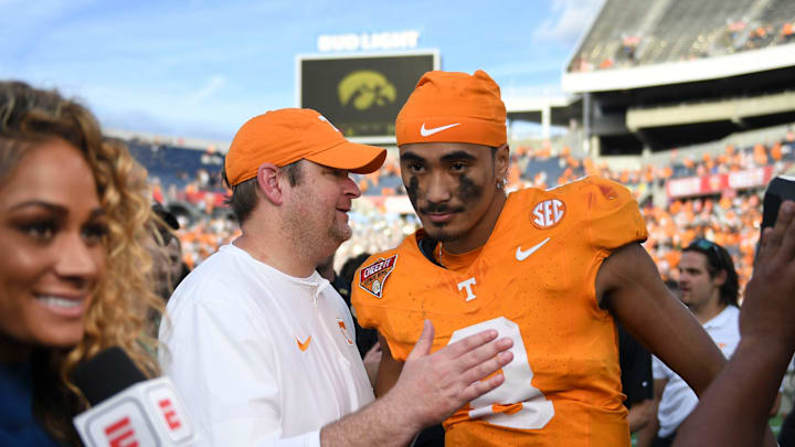 Tennessee head coach Josh Heupel turns to quarterback Nico Iamaleava (8) after their post game interview after winning the Citrus Bowl NCAA College football game on Monday, January 1, 2024 in Orlando, Fla. against Iowa.