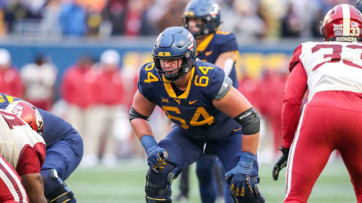 Nov 12, 2022; Morgantown, West Virginia, USA; West Virginia Mountaineers offensive lineman Wyatt Milum (64) during the third quarter against the Oklahoma Sooners at Mountaineer Field at Milan Puskar Stadium. Mandatory Credit: Ben Queen-USA TODAY Sports