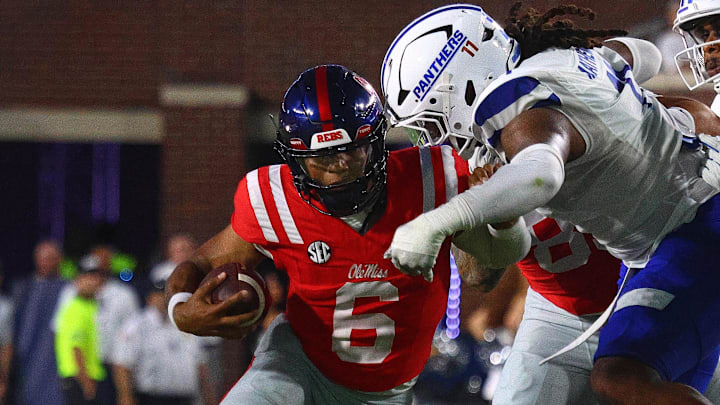 Ole Miss Rebels quarterback Trinidad Chambliss (6) runs the ball as Georgia State Panthers defensive end Ian Mathews (11) makes the tackle during the second quarter  at Vaught-Hemingway Stadium.