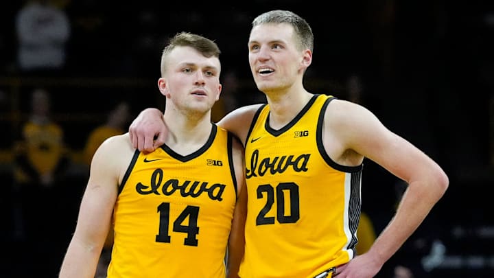 Iowa Hawkeyes guard Carter Kingsbury (14) and Iowa Hawkeyes forward Payton Sandfort (20) stand together as free throws are shot against the Washington Huskies Saturday, Feb. 22, 2025 at Carver-Hawkeye Arenain Iowa City, Iowa. Iowa Hawkeyes guard Carter Kingsbury (14) and Iowa Hawkeyes forward Payton Sandfort (20) stand together as free throws are shot against the Washington Huskies Saturday, Feb. 22, 2025 at Carver-Hawkeye Arenain Iowa City, Iowa.