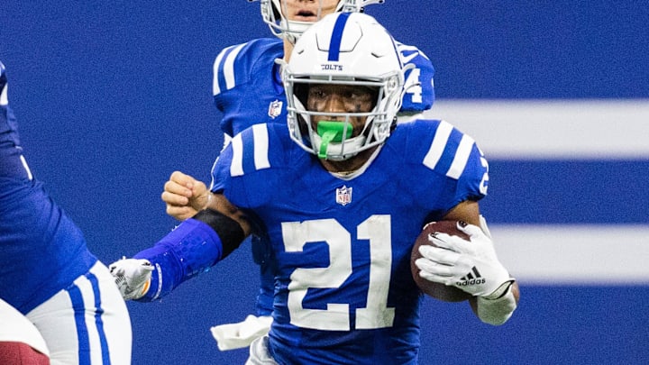 Oct 30, 2022; Indianapolis, Indiana, USA; Indianapolis Colts running back Nyheim Hines (21) runs the ball in the second quarter against the Washington Commanders at Lucas Oil Stadium. 