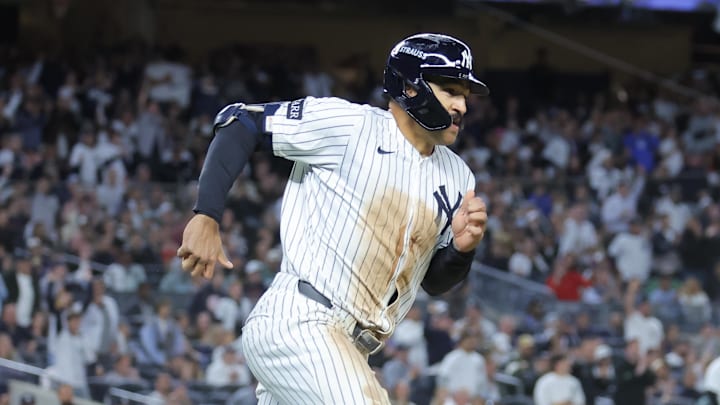 Oct 1, 2025; Bronx, New York, USA; New York Yankees center fielder Trent Grisham (12) rounds the bases after hitting a double during the seventh inning against the Boston Red Sox during game two of the Wildcard round for the 2025 MLB playoffs at Yankee Stadium. Mandatory Credit: Brad Penner-Imagn Images