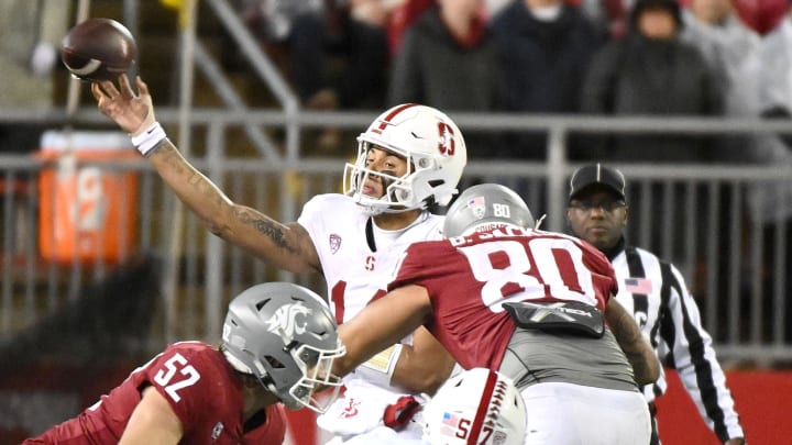 Stanford Cardinal quarterback Ashton Daniels (14) throws a pass against Washington State Cougars defensive end Brennan Jackson (80) in the second half at Gesa Field at Martin Stadium. Stanford won 10-7. 