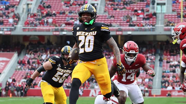 Nov 29, 2025; Fayetteville, Arkansas, USA; Missouri Tigers running back Jamal Roberts (20) rushes for a touchdown during the first quarter against the Arkansas Razorbacks at Donald W. Reynolds Razorback Stadium. Mandatory Credit: Nelson Chenault-Imagn Images Nov 29, 2025; Fayetteville, Arkansas, USA; Missouri Tigers running back Jamal Roberts (20) rushes for a touchdown during the first quarter against the Arkansas Razorbacks at Donald W. Reynolds Razorback Stadium. Mandatory Credit: Nelson Chenault-Imagn Images