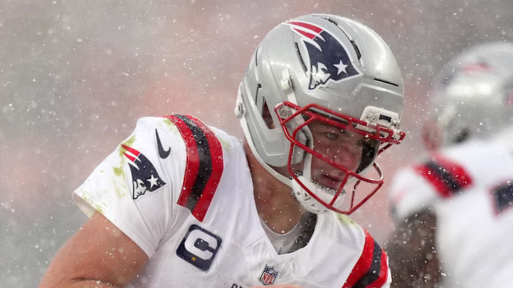 Jan 25, 2026; Denver, CO, USA; New England Patriots quarterback Drake Maye (10) prepares to hand the ball off against the Denver Broncos during the second half in the 2026 AFC Championship Game at Empower Field at Mile High. Mandatory Credit: Ron Chenoy-Imagn Images