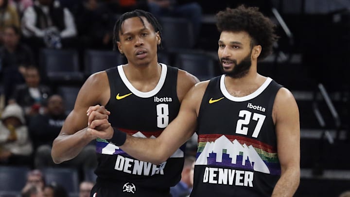 Nov 24, 2025; Memphis, Tennessee, USA; Denver Nuggets guard Peyton Watson (8) reacts with guard Jamal Murray (27) during the fourth quarter against the Memphis Grizzlies at FedExForum.