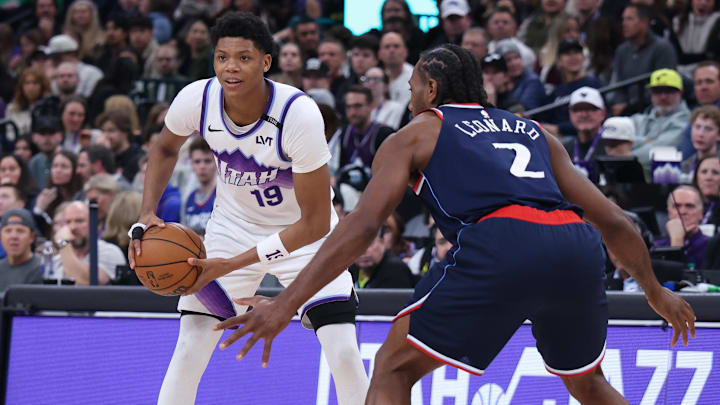 Jan 27, 2026; Salt Lake City, Utah, USA; Utah Jazz guard Ace Bailey (19) looks for the play against LA Clippers forward Kawhi Leonard (2) during the first half at Delta Center. Mandatory Credit: Rob Gray-Imagn Images