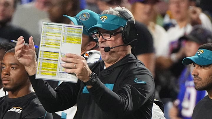 Sep 23, 2024; Orchard Park, New York, USA; Jacksonville Jaguars head coach Doug Pederson looks at his play card during the first half against the Buffalo Bills at Highmark Stadium. Mandatory Credit: Gregory Fisher-Imagn Images