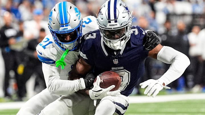 Detroit Lions cornerback Amik Robertson tackles Dallas Cowboys wide receiver George Pickens.