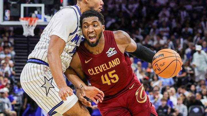 Oct 13, 2026; Orlando, Florida, USA; Cleveland Cavaliers guard Donovan Mitchell (45) drives past Orlando Magic forward Noah Penda (93) during the second half at Kia Center. Mandatory Credit: Mike Watters-Imagn Images Oct 13, 2026; Orlando, Florida, USA; Cleveland Cavaliers guard Donovan Mitchell (45) drives past Orlando Magic forward Noah Penda (93) during the second half at Kia Center. Mandatory Credit: Mike Watters-Imagn Images