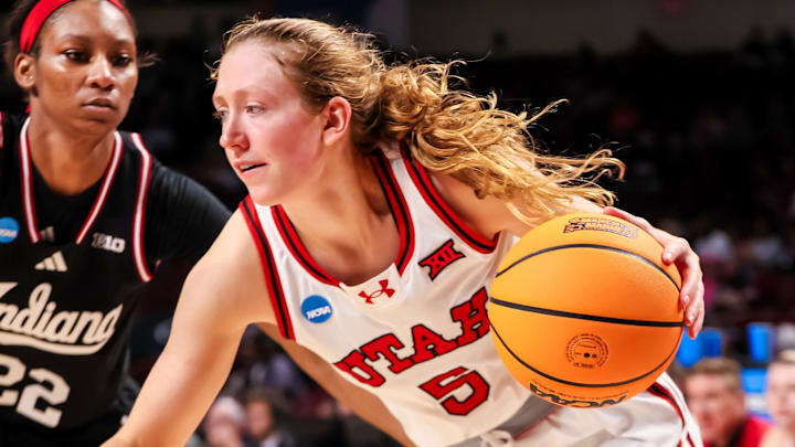 Mar 21, 2025; Columbia, South Carolina, USA; Utah Utes guard Gianna Kneepkens (5) drives past Indiana Hoosiers guard Chloe Moore-McNeil (22) in the second half at Colonial Life Arena. Mandatory Credit: Jeff Blake-Imagn Images Mar 21, 2025; Columbia, South Carolina, USA; Utah Utes guard Gianna Kneepkens (5) drives past Indiana Hoosiers guard Chloe Moore-McNeil (22) in the second half at Colonial Life Arena. Mandatory Credit: Jeff Blake-Imagn Images