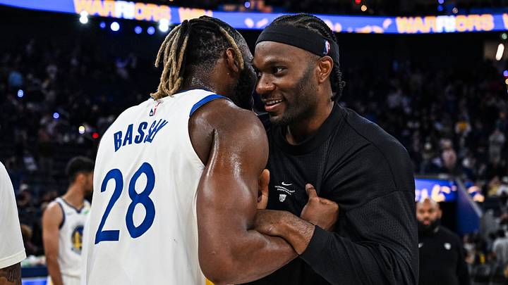 Oct 10, 2026; San Francisco, California, USA;  Golden State Warriors forward/center Charles Bassey (28) and Sacramento Kings forward Precious Achiuwa (9) interact after the Warriors beat the Kings during a game at Chase Center.  Mandatory Credit: Justine Willard-Imagn Images