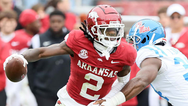 Arkansas Razorbacks wide receiver Andrew Armstrong (2) runs after a catch in the fourth quarter as Ole Miss Rebels linebacker Tyler Banks (34) defends at Razorback Stadium in Fayetteville, Ark.