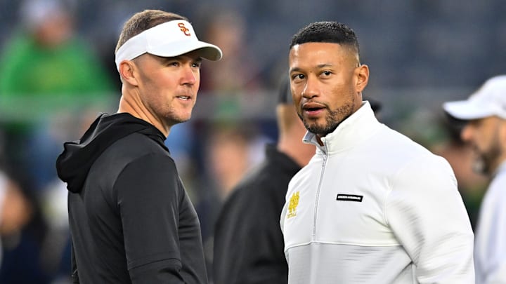 Oct 14, 2023; South Bend, Indiana, USA; USC Trojans head coach Lincoln Riley and Notre Dame Fighting Irish head coach Marcus Freeman chat before the game at Notre Dame Stadium. Oct 14, 2023; South Bend, Indiana, USA; USC Trojans head coach Lincoln Riley and Notre Dame Fighting Irish head coach Marcus Freeman chat before the game at Notre Dame Stadium.