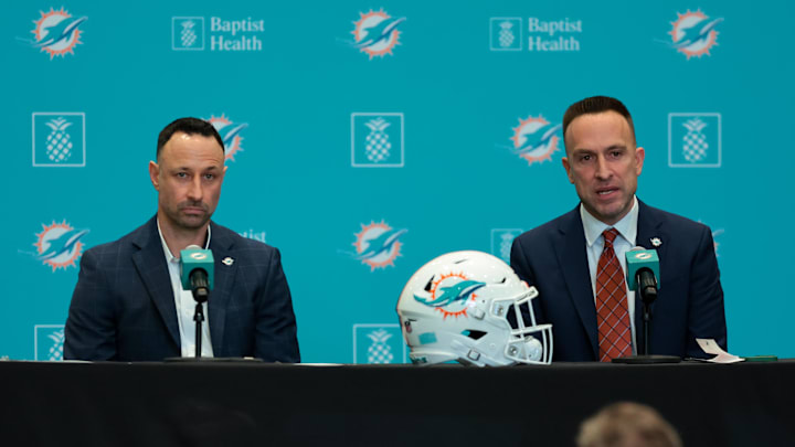 Jan 22, 2026; Miami Gardens, FL, USA; Miami Dolphins head coach Jeff Hafley, right, joined by general manager Jon-Eric Sullivan, left, speak to reporters during their introductory press conference at Baptist Health Training Complex. Mandatory Credit: Sam Navarro-Imagn Images