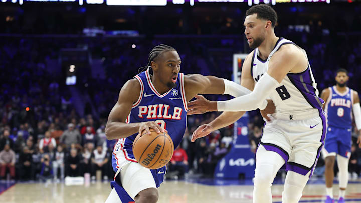 Jan 29, 2026; Philadelphia, Pennsylvania, USA; Philadelphia 76ers guard Tyrese Maxey (0) drives against Sacramento Kings guard Zach LaVine (8) during the fourth quarter at Xfinity Mobile Arena.