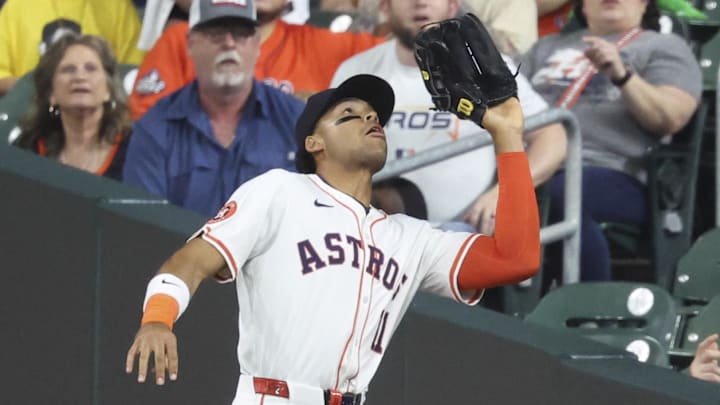 Apr 1, 2025; Houston, Texas, USA; Houston Astros right fielder Cam Smith (11) catches a fly ball during the second inning against the San Francisco Giants at Daikin Park.