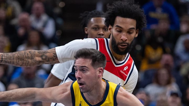 Indiana Pacers guard T.J. McConnell dribbles the ball while Washington Wizards forward Justin Champagnie defends Indiana Pacers guard T.J. McConnell dribbles the ball while Washington Wizards forward Justin Champagnie defends