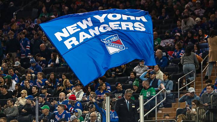 Mar 16, 2025; New York, New York, USA; A New York Rangers flag is seen in the crown during the first period against the Edmonton Oilers at Madison Square Garden. Mandatory Credit: Danny Wild-Imagn Images