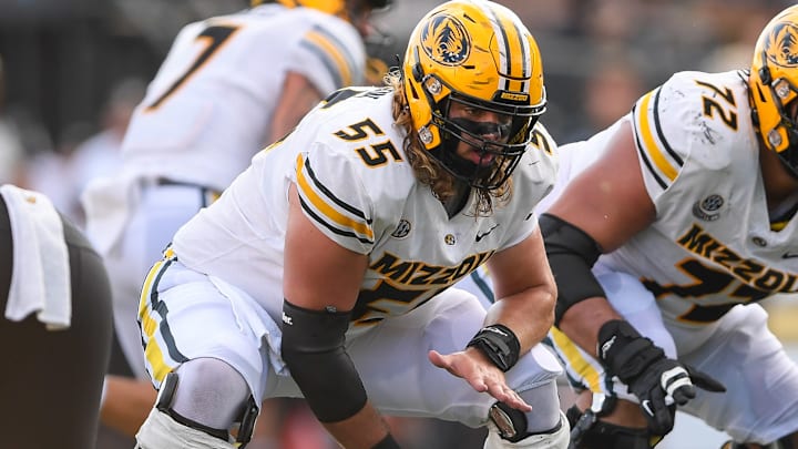 Sep 30, 2023; Nashville, Tennessee, USA; Missouri Tigers offensive lineman Connor Tollison (55) snaps the ball against the Vanderbilt Commodores during the second half at FirstBank Stadium.
