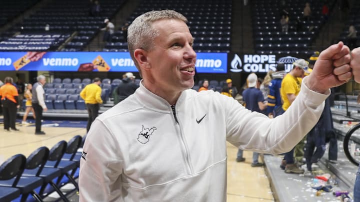 Jan 27, 2026; Morgantown, West Virginia, USA; West Virginia Mountaineers head coach Ross Hodge celebrates with fans after defeating the Kansas State Wildcats at Hope Coliseum. Mandatory Credit: Ben Queen-Imagn Imagesa