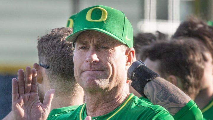 Oregon baseball coach Mark Wasikowski joins his team before their home opener against the Lafayette Leopards at PK Park in Eugene Friday, Feb. 23, 2024.