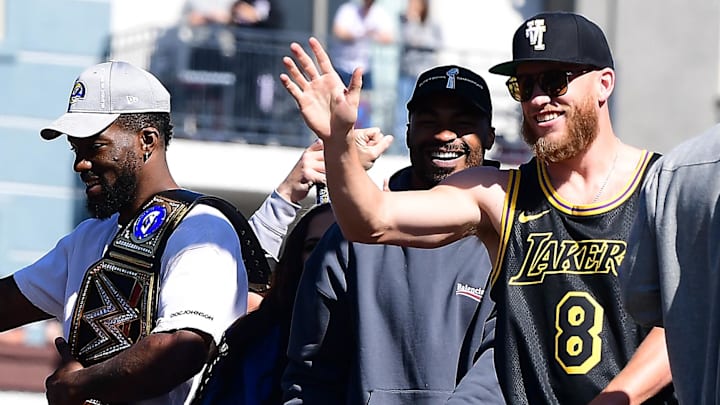 Feb 16, 2022; Los Angeles, CA, USA; Los Angeles Rams wide receiver Cooper Kupp wide receiver Robert Woods and outside linebacker Leonard Floyd celebrate during the Los Angeles Rams Championship Parade. Mandatory Credit: Gary A. Vasquez-Imagn Images