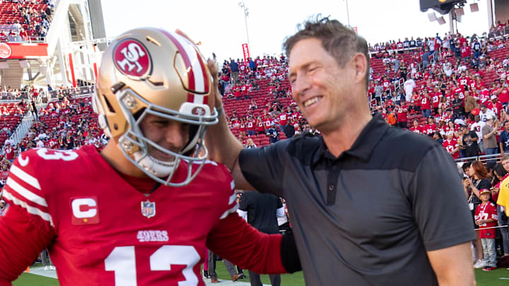 San Francisco 49ers quarterback Brock Purdy (13) with Hall of Famer Steve Young (R)