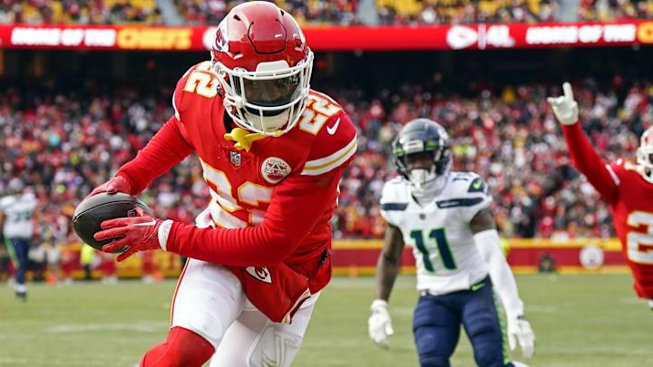 Dec 24, 2022; Kansas City, Missouri, USA; Kansas City Chiefs safety Juan Thornhill (22) intercepts a pass intended for Seattle Seahawks wide receiver Marquise Goodwin (11) as Kansas City Chiefs cornerback Trent McDuffie (21) celebrates during the second half at GEHA Field at Arrowhead Stadium. Mandatory Credit: Jay Biggerstaff-Imagn Images Dec 24, 2022; Kansas City, Missouri, USA; Kansas City Chiefs safety Juan Thornhill (22) intercepts a pass intended for Seattle Seahawks wide receiver Marquise Goodwin (11) as Kansas City Chiefs cornerback Trent McDuffie (21) celebrates during the second half at GEHA Field at Arrowhead Stadium. Mandatory Credit: Jay Biggerstaff-Imagn Images