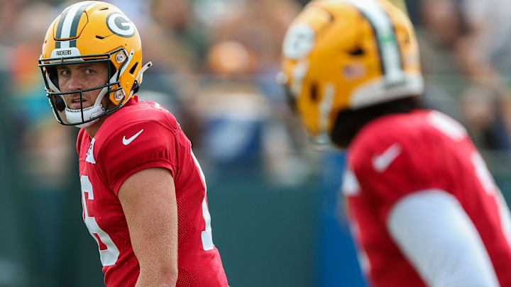 Green Bay Packers quarterback Sean Clifford (16) looks over to Malik Willis (2) in a drill during practice on Tuesday, August 12, 2025, at Ray Nitschke Field in Ashwaubenon, Wis.