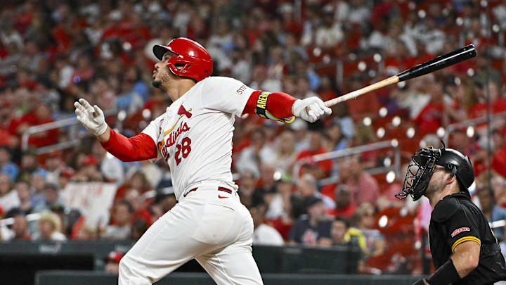 Sep 18, 2024; St. Louis, Missouri, USA;  St. Louis Cardinals third baseman Nolan Arenado (28) hits a one run single against the Pittsburgh Pirates during the third inning at Busch Stadium.