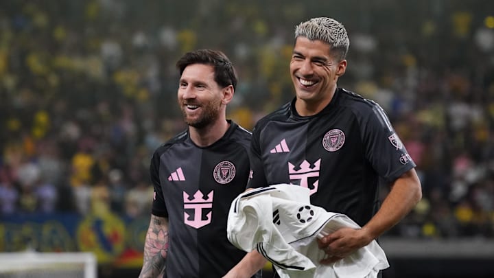 Jan 18, 2025; Las Vegas, Nevada, USA; Inter Miami CF forward Lionel Messi (10) and Inter Miami CF forward Luis Suarez (9) walk off the field laughing at the end of regulation against Club America at Allegiant Stadium. Mandatory Credit: David Gonzales-Imagn Images
