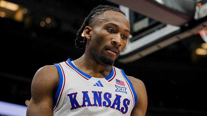 Dec 7, 2025; Kansas City, Missouri, USA; Kansas Jayhawks guard Darryn Peterson (22) reacts during the first half against the Missouri Tigers at T-Mobile Center. Mandatory Credit: Jay Biggerstaff-Imagn Images