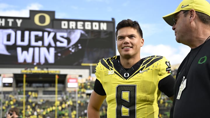 Oct 26, 2024; Eugene, Oregon, USA; Oregon Ducks quarterback Dillon Gabriel (8) waits to be interviewed after a game against the Illinois Fighting Illini at Autzen Stadium. Mandatory Credit: Troy Wayrynen-Imagn Images Oct 26, 2024; Eugene, Oregon, USA; Oregon Ducks quarterback Dillon Gabriel (8) waits to be interviewed after a game against the Illinois Fighting Illini at Autzen Stadium. Mandatory Credit: Troy Wayrynen-Imagn Images