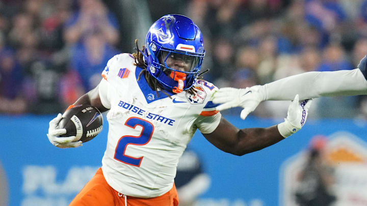 Boise State Broncos running back Ashton Jeanty (2) runs past Penn State Nittany Lions linebacker Kobe King (41) during their Vrbo Fiesta Bowl matchup at State Farm Stadium on Dec. 31, 2024. Boise State Broncos running back Ashton Jeanty (2) runs past Penn State Nittany Lions linebacker Kobe King (41) during their Vrbo Fiesta Bowl matchup at State Farm Stadium on Dec. 31, 2024.
