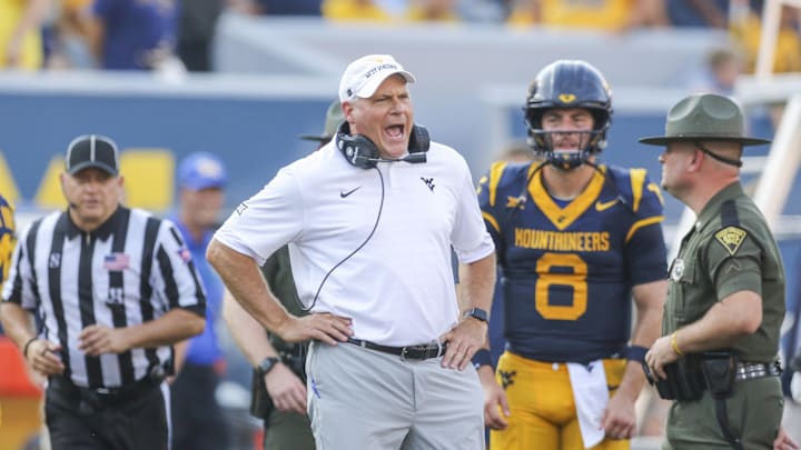 West Virginia Mountaineers head coach Rich Rodriguez yells at the referee during the second quarter against the Pittsburgh Panthers at Milan Puskar Stadium. West Virginia Mountaineers head coach Rich Rodriguez yells at the referee during the second quarter against the Pittsburgh Panthers at Milan Puskar Stadium.