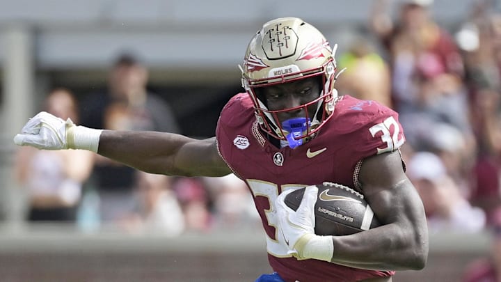 Oct 11, 2025; Tallahassee, Florida, USA; Florida State Seminoles running back Ousmane Kromah (32) is tackled by Pittsburgh Panthers linebacker Braylan Lovelace (0) during the second half at Doak S. Campbell Stadium. Mandatory Credit: Melina Myers-Imagn Images