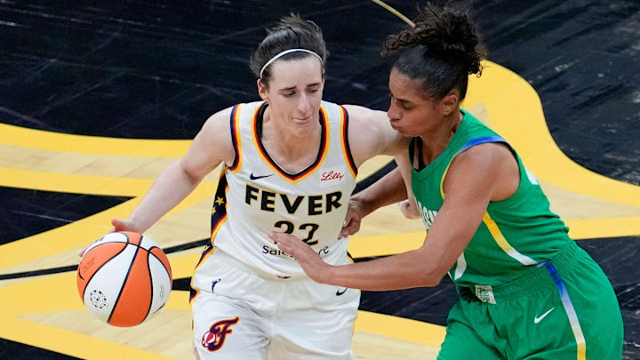 Indiana Fever guard Caitlin Clark (22) brings the ball up court as BrazilÕs Carina Dos Santos Martins (17) defends during an WNBA game May 4, 2025 at Carver-Hawkeye Arena in Iowa City, Iowa. Indiana Fever guard Caitlin Clark (22) brings the ball up court as BrazilÕs Carina Dos Santos Martins (17) defends during an WNBA game May 4, 2025 at Carver-Hawkeye Arena in Iowa City, Iowa.