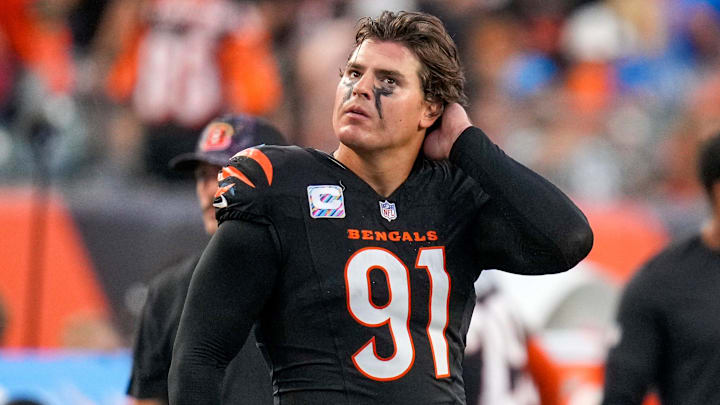 Cincinnati Bengals defensive end Trey Hendrickson (91) watches a replay as the Detroit Lions celebrate a touchdown in the fourth quarter of the NFL Week 5 game between the Cincinnati Bengals and the Detroit Lions at Paycor Stadium in downtown Cincinnati on Sunday, Oct. 5, 2025. The Bengals continued a losing streak, falling 37-24 to the Lions. Cincinnati Bengals defensive end Trey Hendrickson (91) watches a replay as the Detroit Lions celebrate a touchdown in the fourth quarter of the NFL Week 5 game between the Cincinnati Bengals and the Detroit Lions at Paycor Stadium in downtown Cincinnati on Sunday, Oct. 5, 2025. The Bengals continued a losing streak, falling 37-24 to the Lions.