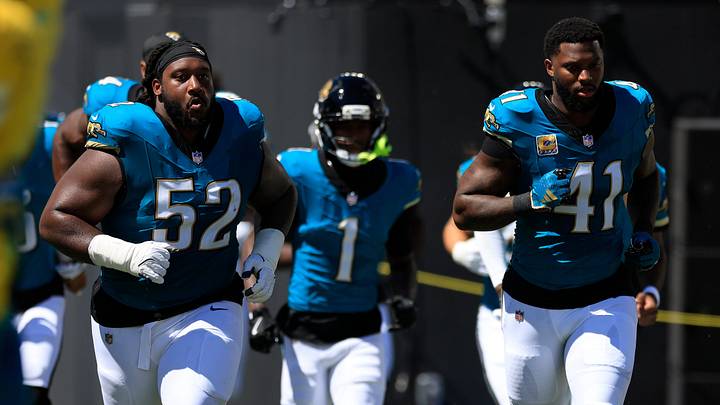 Jacksonville Jaguars defensive tackle Davon Hamilton (52) and defensive end Josh Hines-Allen (41) before an NFL football matchup at EverBank Stadium on Sunday, Sept. 27, 2026, in Jacksonville, Fla. The Jaguars defeated the Patriots 35-6. [Corey Perrine/Florida Times‑Union]