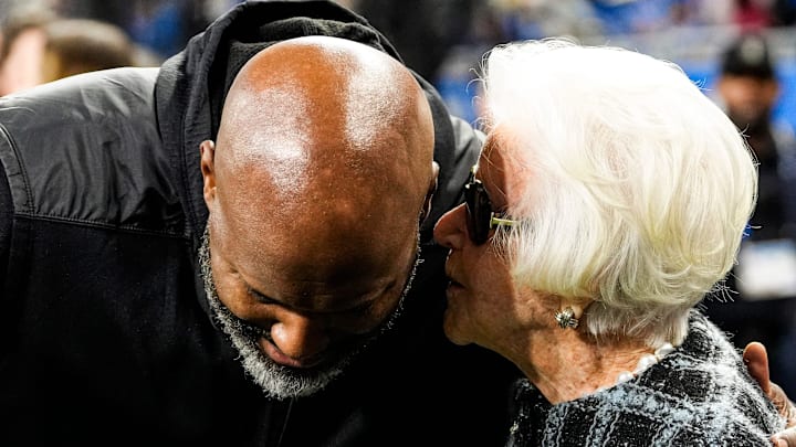 Detroit Lions general manager Brad Holmes talks to Martha Ford during warmup ahead of the Green Bay Packers game 