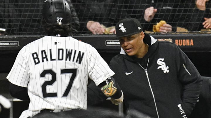Chicago White Sox manager Will Venable (1) with  shortstop Brooks Baldwin (27) against the Minnesota Twins at Rate Field. 
