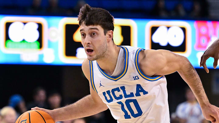 Nov 11, 2024; Los Angeles, California, USA; UCLA Bruins guard Lazar Stefanovic (10) brings the ball down the court adhering the second half against the Boston University Terriers at Pauley Pavilion presented by Wescom. Mandatory Credit: Robert Hanashiro-Imagn Images