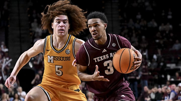Texas A&M Aggies guard Rylan Griffen drives against Missouri Tigers guard T.O. Barrett during the second half at Reed Arena. 